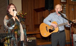 Karen McIvor and James Hamilton pictured performing a few John Denver songs.